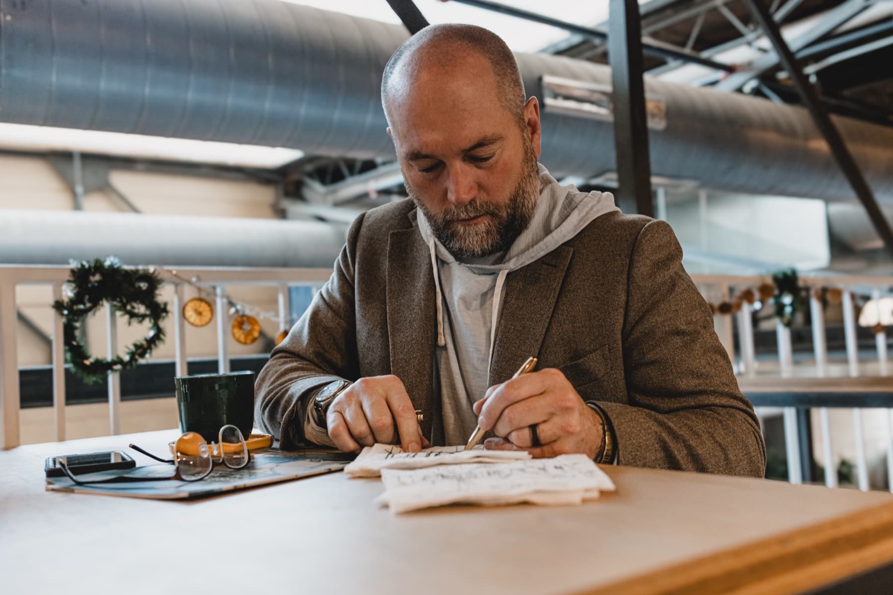 Robert Floyd writing ideas in a notebook